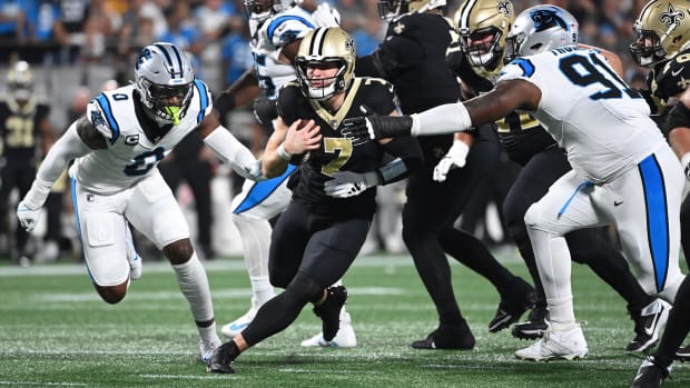 Taysom Hill (7) of the New Orleans Saints runs against the Carolina Panthers  