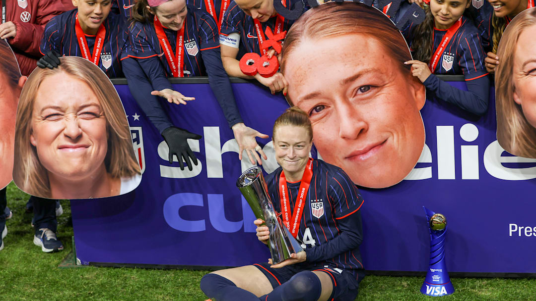 Emily Sonnett sits with the trophy and medal after winning SheBelieves Cup 2026