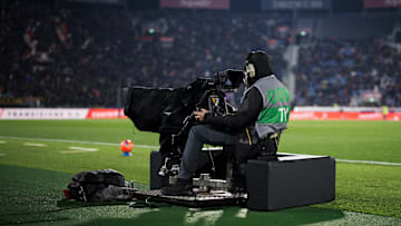 A cameraman works with a TV camera prior to the Serie A...