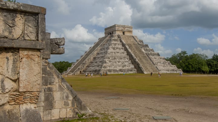 Tourists in front of the Maya's Temple of Kukulcan in Yucatán, Mexico.