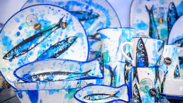 Craft plates and vases featuring images of sardines for sale...