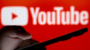 In this photo illustration, the YouTube logo seen in the...