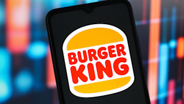 In this photo illustration, the Burger King (BK) logo is...