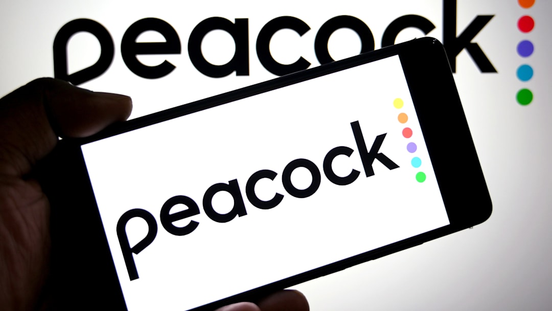 In this photo illustration, a Peacock logo is seen displayed...