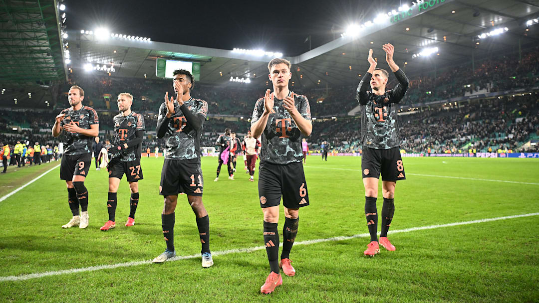 Bayern Munich players applauding away fans at Celtic Park.