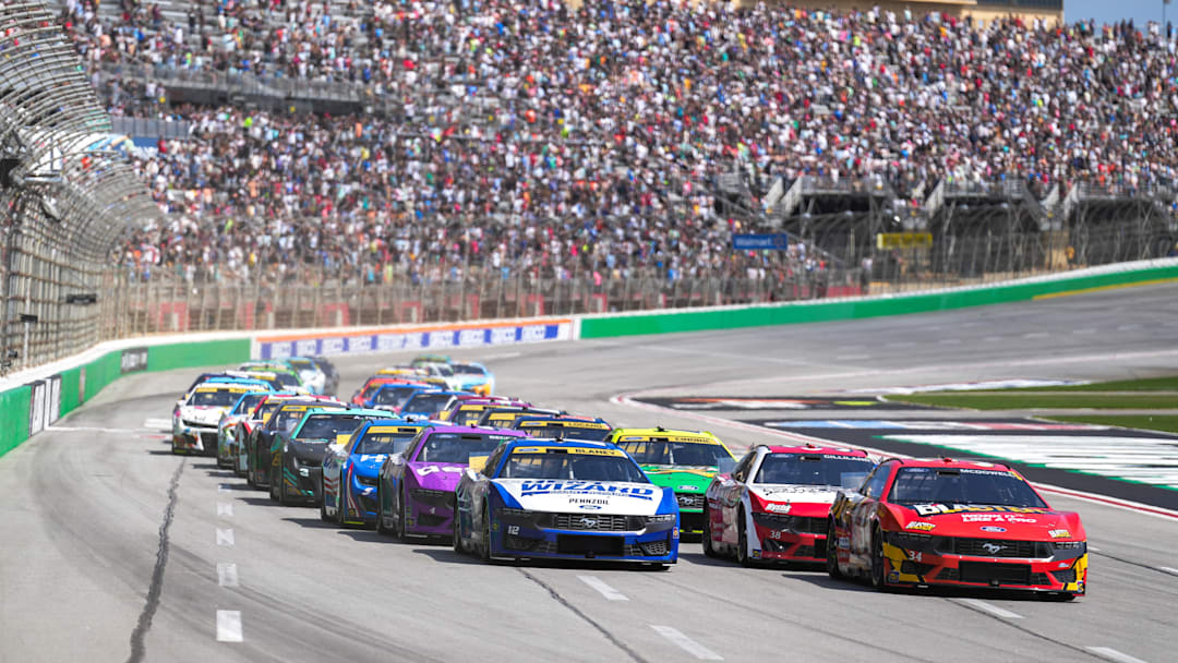 Sep 8, 2024; Hampton, Georgia, USA; NASCAR Cup Series driver Michael McDowell (34) leads the pack to begin the race at Atlanta Motor Speedway. Mandatory Credit: Jason Allen-Imagn Images