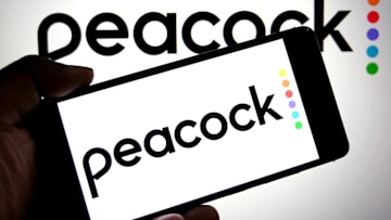 In this photo illustration, a Peacock logo is seen displayed...