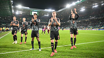 Bayern Munich players applauding away fans at Celtic Park.