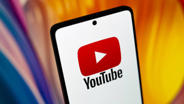 In this photo illustration, the YouTube logo is displayed on...