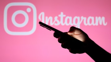 In this photo illustration, the Instagram logo seen in the...