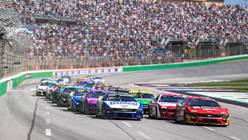 Sep 8, 2024; Hampton, Georgia, USA; NASCAR Cup Series driver Michael McDowell (34) leads the pack to begin the race at Atlanta Motor Speedway. Mandatory Credit: Jason Allen-Imagn Images