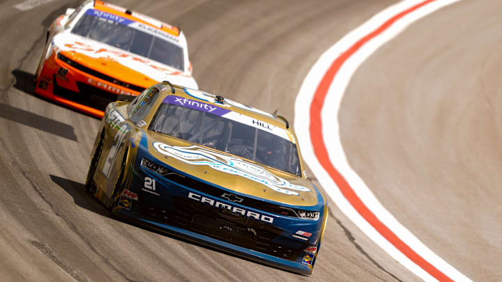 Sep 7, 2024; Hampton, Georgia, USA; Xfinity Series driver Austin Hill (21) and Xfinity Series driver Parker Kligerman (48) enter turn four at Atlanta Motor Speedway. Mandatory Credit: Jason Allen-Imagn Images