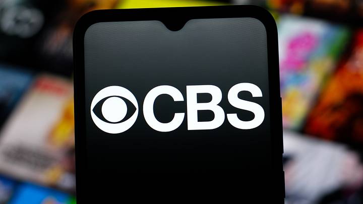 In this photo illustration, the CBS (Columbia Broadcasting System) logo is seen displayed on a smartphone screen. 
