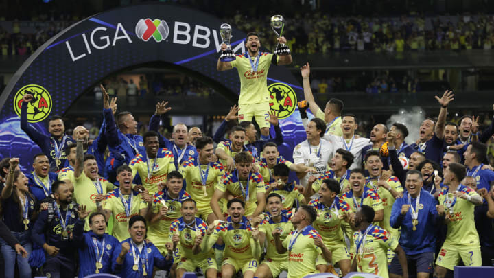 Henry Martín #21, of Club America lifts the Liga MX...