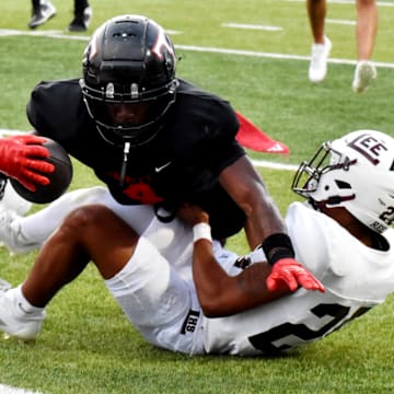 Euless Trinity running back Keondre Dixon dives for a touchdown against Midland Lee in the first quarter of a game on Sept. 5. 