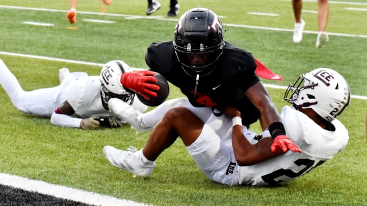 Euless Trinity running back Keondre Dixon dives for a touchdown against Midland Lee in the first quarter of a game on Sept. 5. 