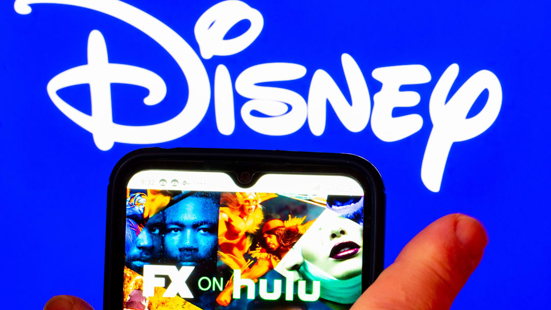 In this photo illustration, the FX on Hulu logo is displayed...
