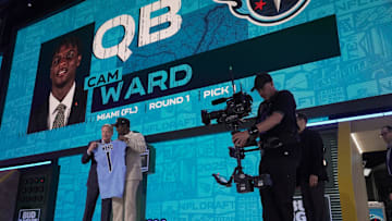 Quarterback Cam Ward from Miami poses with NFL Commissioner Roger Goodell after being selected 1st overall by the Tennessee Titans during the first round of the 2025 NFL Draft.
