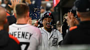Detroit Tigers' Javier Baez celebrates in the dugout after hitting a three-run home run.