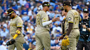 Oct 1, 2025; Chicago, Illinois, USA; San Diego Padres relief pitcher Robert Suarez (75) celebrates with teammates after the final out for the win against the Chicago Cubs in the ninth inning during game two of the Wildcard round for the 2025 MLB playoffs at Wrigley Field. Mandatory Credit: Matt Marton-Imagn Images