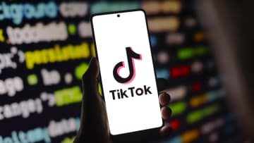 In this photo illustration, the TikTok logo is displayed on...