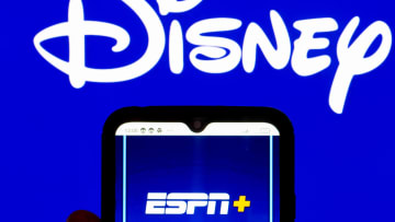 In this photo illustration, the ESPN+ logo is displayed on a...