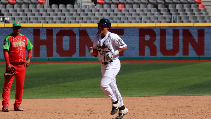 Dayson Croes #12 of Kane County Cougars runs during the...