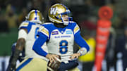 Nov 20, 2022; Regina, Saskatchewan, CAN;  Winnipeg Blue Bombers quarterback Zach Collaros (8) drops back to pass against the Toronto Argonauts in the second half. The Argonauts defeated the Blue Bombers to win the 2022 Grey Cup Championship at Mosaic Stadium. Toronto won 24-23. Mandatory Credit: Bob Frid-Imagn Images