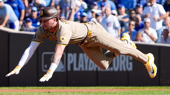 Sep 30, 2025; Chicago, Illinois, USA; San Diego Padres outfielder Jackson Merrill (3) slides into second base after hitting a double in the second inning against the Chicago Cubs during game one of the Wildcard round for the 2025 MLB playoffs at Wrigley Field. Mandatory Credit: David Banks-Imagn Images