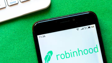 In this photo illustration a Robinhood logo seen displayed...