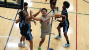 July 17, 2024; North Augusta, S.C., USA; Team Takeover's Derek Dixon (3) shoots the ball as WhyNot's Tae Simmons (15) defends during the Team Takeover and WhyNot game at the Nike Peach Jam at Riverview Park Activities Center. Team Takeover won 64-62