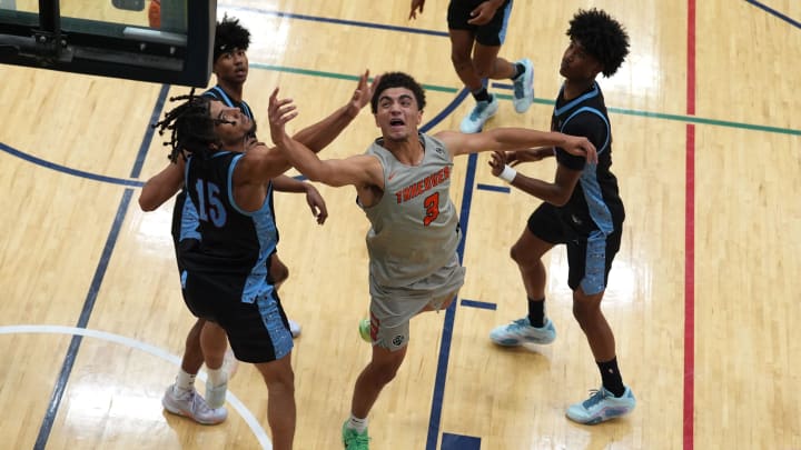 July 17, 2024; North Augusta, S.C., USA; Team Takeover's Derek Dixon (3) shoots the ball as WhyNot's Tae Simmons (15) defends during the Team Takeover and WhyNot game at the Nike Peach Jam at Riverview Park Activities Center. Team Takeover won 64-62