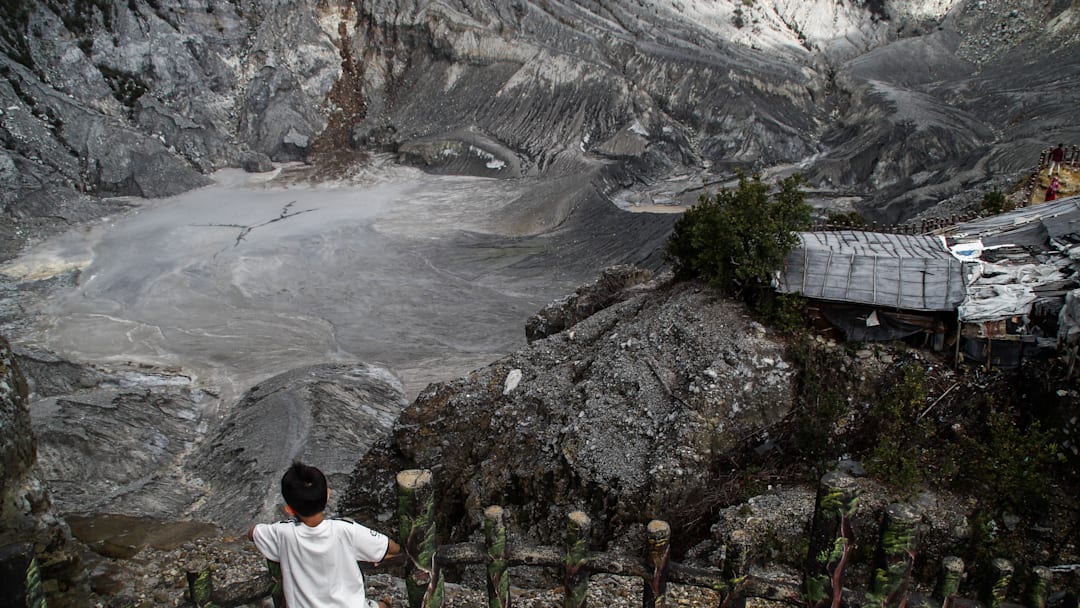 A child seen at an active crater on Mount Tangkuban Perahu...