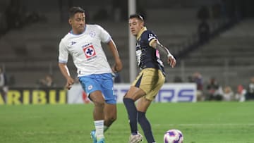 Luis Romo #27 of Cruz Azul and Robert Ergas #22 of Pumas...