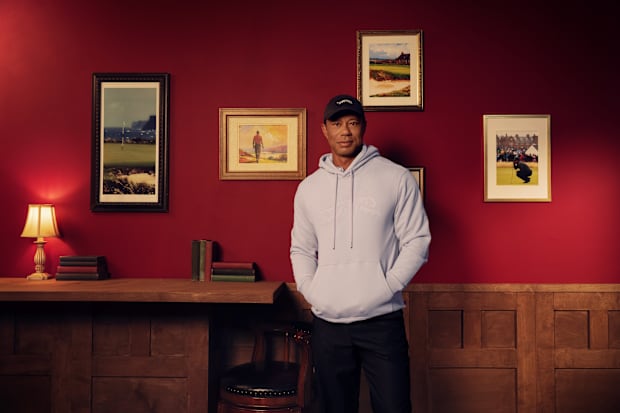Tiger Woods models Sun Day Red apparel.