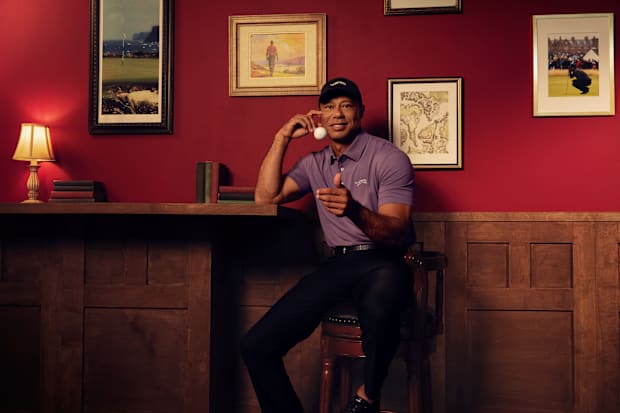 Tiger Woods models Sun Day Red apparel.