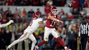Oklahoma Sooners quarterback Jackson Arnold (11) throws a pass beside Alabama Crimson Tide defensive back Domani Jackson (1) during a college football game between the University of Oklahoma Sooners (OU) and the Alabama Crimson Tide at Gaylord Family - Oklahoma Memorial Stadium in Norman, Okla., Saturday, Nov. 23, 2024. Oklahoma won 24-3.