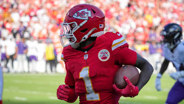 Sep 28, 2025; Kansas City, Missouri, USA; Kansas City Chiefs wide receiver Xavier Worthy (1) runs the ball against the Baltimore Ravens during the game at GEHA Field at Arrowhead Stadium. Mandatory Credit: Denny Medley-Imagn Images