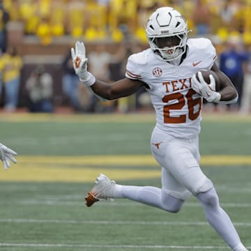 Sep 7, 2024; Ann Arbor, Michigan, USA; Texas Longhorns running back Quintrevion Wisner (26) rushes in the first half against the Michigan Wolverines at Michigan Stadium. Mandatory Credit: Rick Osentoski-Imagn Images