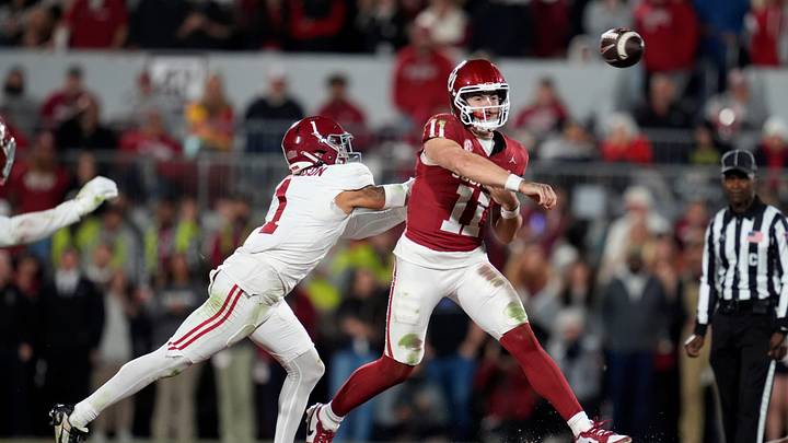 Oklahoma Sooners quarterback Jackson Arnold (11) throws a pass beside Alabama Crimson Tide defensive back Domani Jackson (1) during a college football game between the University of Oklahoma Sooners (OU) and the Alabama Crimson Tide at Gaylord Family - Oklahoma Memorial Stadium in Norman, Okla., Saturday, Nov. 23, 2024. Oklahoma won 24-3.