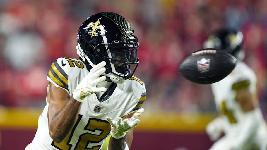 Oct 7, 2024; Kansas City, Missouri, USA; New Orleans Saints wide receiver Chris Olave (12) catches a pass during the second half against the Kansas City Chiefs at GEHA Field at Arrowhead Stadium. Mandatory Credit: Jay Biggerstaff-Imagn Images | Jay Biggerstaff-Imagn Images