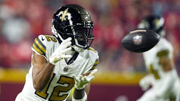 Oct 7, 2024; Kansas City, Missouri, USA; New Orleans Saints wide receiver Chris Olave (12) catches a pass during the second half against the Kansas City Chiefs at GEHA Field at Arrowhead Stadium. Mandatory Credit: Jay Biggerstaff-Imagn Images