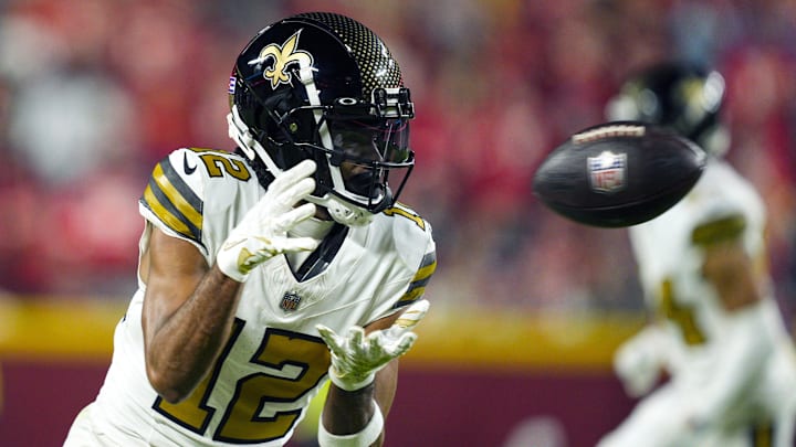 Oct 7, 2024; Kansas City, Missouri, USA; New Orleans Saints wide receiver Chris Olave (12) catches a pass during the second half against the Kansas City Chiefs at GEHA Field at Arrowhead Stadium. Mandatory Credit: Jay Biggerstaff-Imagn Images