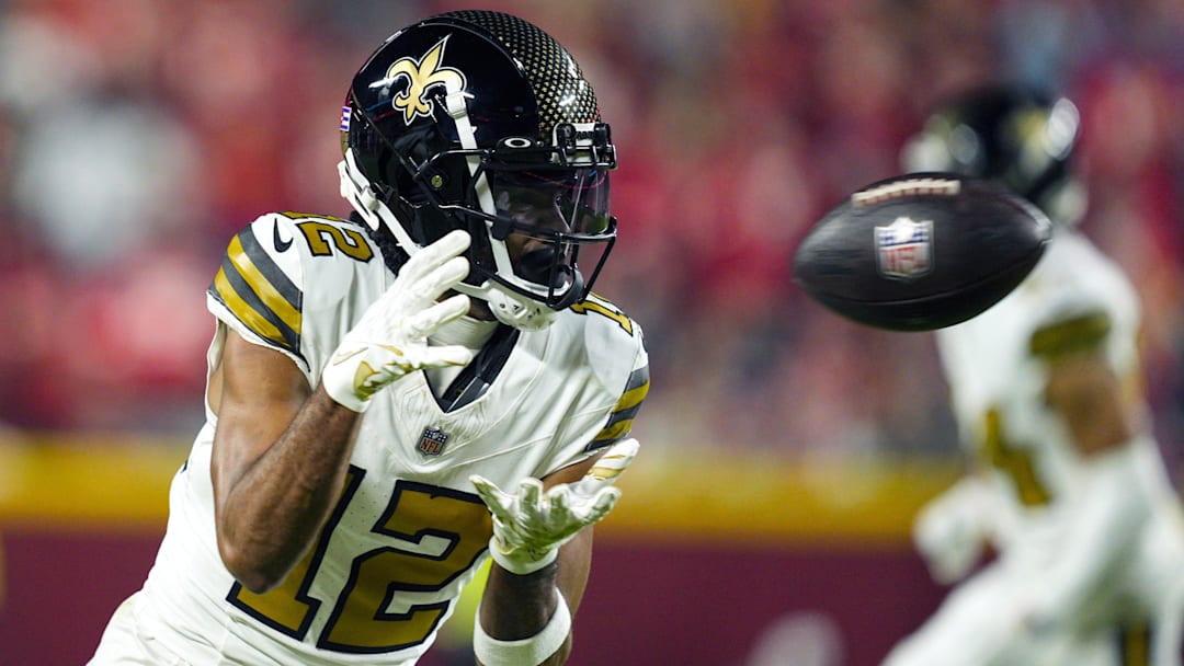 Oct 7, 2024; Kansas City, Missouri, USA; New Orleans Saints wide receiver Chris Olave (12) catches a pass during the second half against the Kansas City Chiefs at GEHA Field at Arrowhead Stadium. Mandatory Credit: Jay Biggerstaff-Imagn Images