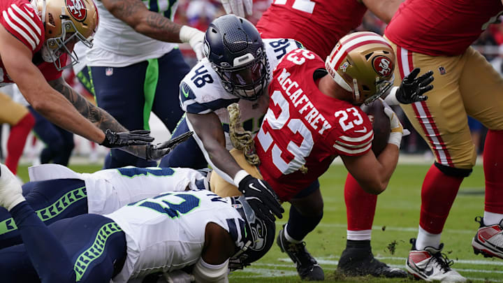Nov 17, 2024; Santa Clara, California, USA; San Francisco 49ers running back Christian McCaffrey (23) is tackled by Seattle Seahawks linebacker Tyrice Knight (48) in the first quarter at Levi's Stadium. Mandatory Credit: David Gonzales-Imagn Images Nov 17, 2024; Santa Clara, California, USA; San Francisco 49ers running back Christian McCaffrey (23) is tackled by Seattle Seahawks linebacker Tyrice Knight (48) in the first quarter at Levi's Stadium. Mandatory Credit: David Gonzales-Imagn Images