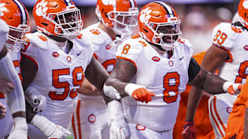 Aug 31, 2024; Atlanta, Georgia, USA; Clemson Tigers offensive lineman Dietrick Pennington (59) and defensive tackle Tre Williams (8) walk together on the field prior to the game against the Georgia Bulldogs at Mercedes-Benz Stadium. Mandatory Credit: Dale Zanine-Imagn Images