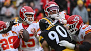 Dec 25, 2024; Pittsburgh, Pennsylvania, USA; Kansas City Chiefs quarterback Patrick Mahomes (15) looks to pass while being pressured by Pittsburgh Steelers linebacker T.J. Watt (90) during the first quarter at Acrisure Stadium. Mandatory Credit: Barry Reeger-Imagn Images