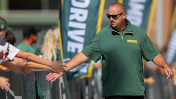 Green Bay Packers offensive coordinator Adam Stenavich slaps hands with fans as he walks to a joint practice with the Baltimore Ravens on Thursday, August 22, 2024, at Lambeau Field in Green Bay, Wis.
Tork Mason/USA TODAY NETWORK-Wisconsin