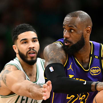 Mar 8, 2025; Boston, Massachusetts, USA; Los Angeles Lakers forward LeBron James (23) controls the ball against Boston Celtics forward Jayson Tatum (0) during the fourth quarter at the TD Garden. Mandatory Credit: Brian Fluharty-Imagn Images