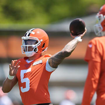 May 10, 2025; Berea, OH, USA; Cleveland Browns quarterback Dillon Gabriel (5) passes as quarterback Shedeur Sanders (12) looks on during rookie minicamp at CrossCountry Mortgage Campus. Mandatory Credit: Ken Blaze-Imagn Images